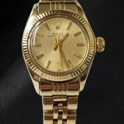 Montre Rolex Oyster Perpetual 24 mm avec cadran bâton de champagne en or jaune