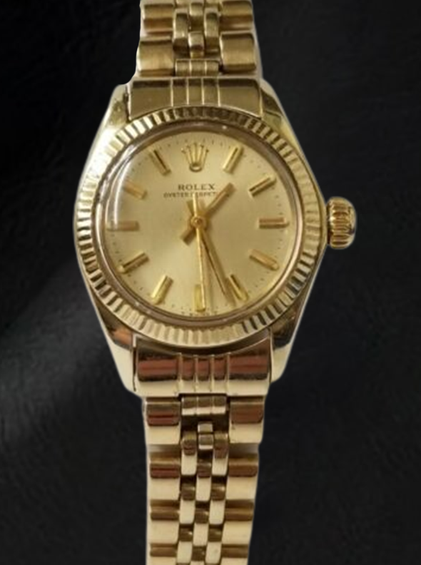 Montre Rolex Oyster Perpetual 24 mm avec cadran bâton de champagne en or jaune