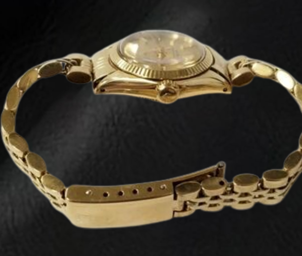 Montre Rolex Oyster Perpetual 24 mm avec cadran bâton de champagne en or jaune