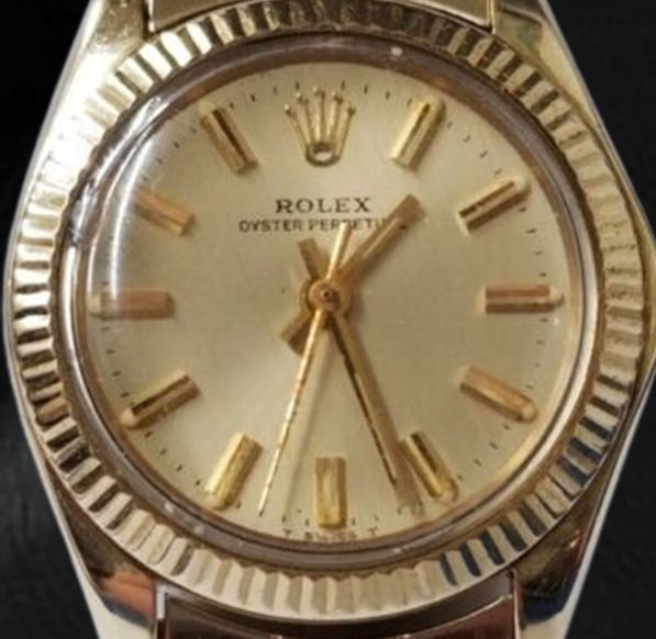 Montre Rolex Oyster Perpetual 24 mm avec cadran bâton de champagne en or jaune