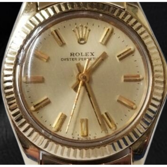Montre Rolex Oyster Perpetual 24 mm avec cadran bâton de champagne en or jaune