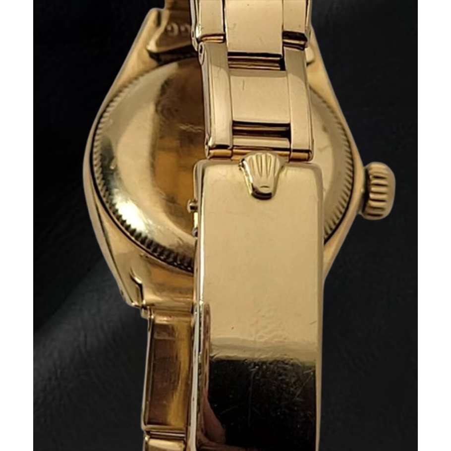 Montre Rolex Oyster Perpetual 24 mm avec cadran champagne et bracelet Oyster en or jaune