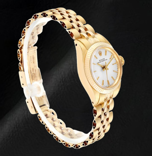 Montre Rolex Oyster Perpetual pour femme avec cadran argenté et or jaune 24 mm