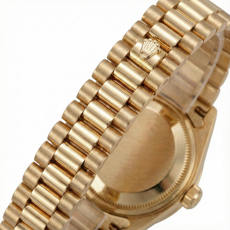 Montre Rolex President en or jaune, cadran champagne serti de diamants et lunette sertie de diamants 