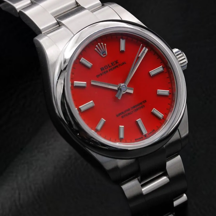 Montre Rolex dame huître Perpétuelle 31 mm en acier à cadran lumineux rouge corail
