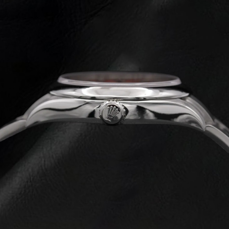 Montre Rolex dame huître Perpétuelle 31 mm en acier à cadran lumineux rouge corail