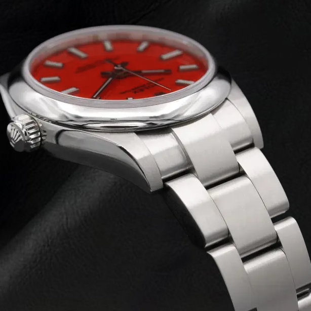 Montre Rolex dame huître Perpétuelle 31 mm en acier à cadran lumineux rouge corail