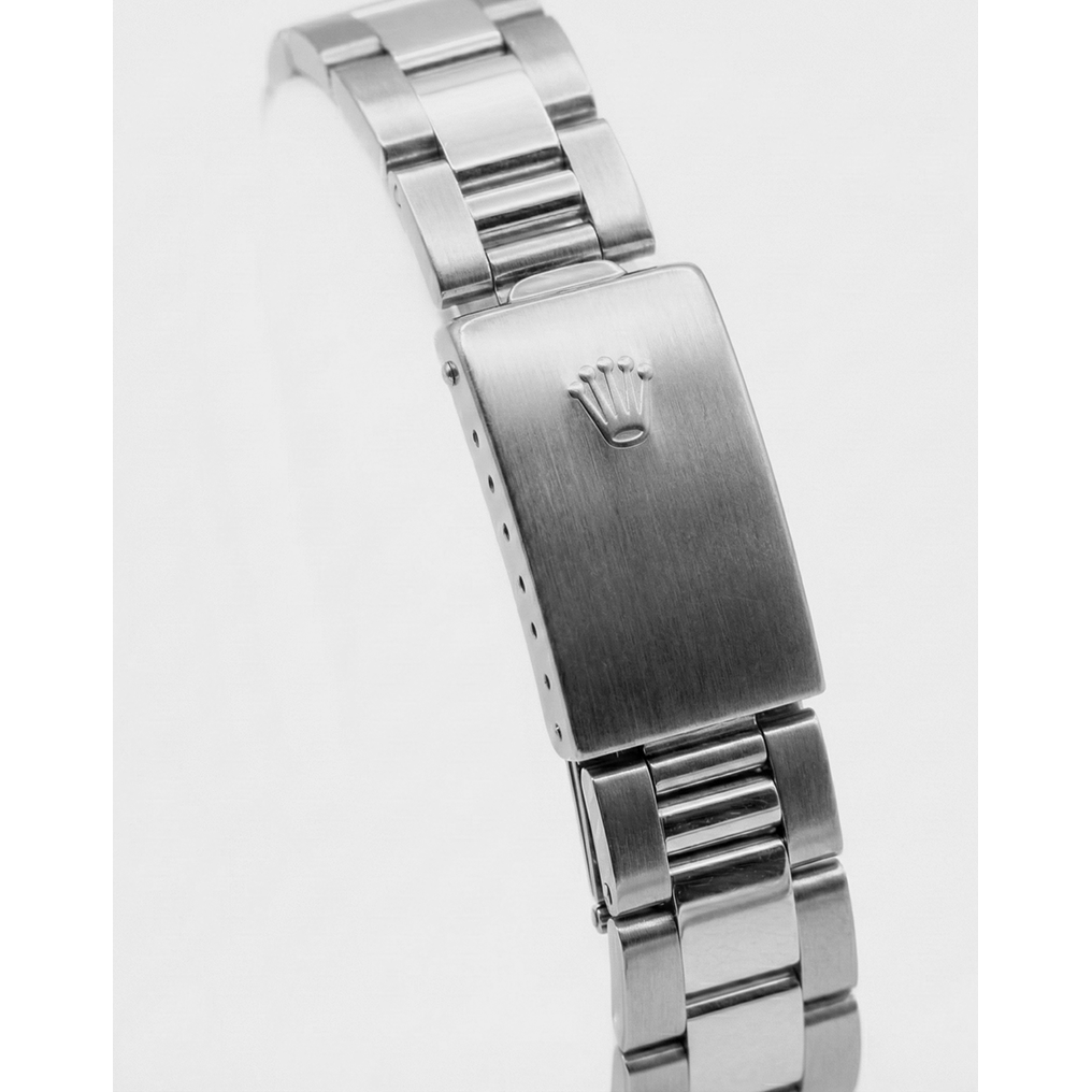 Montre à cadran bâton Rolex de taille moyenne, bracelet acier inoxydable huître, lunette en diamant