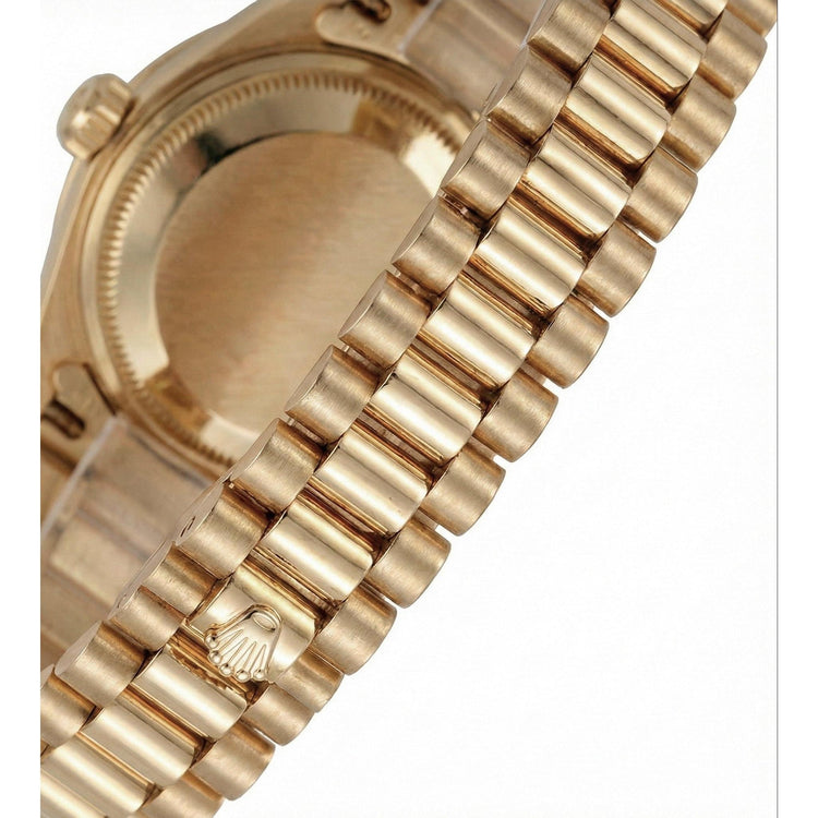 Montre de still président datejust Rolex en or, cadran romain blanc, lunette en diamant
