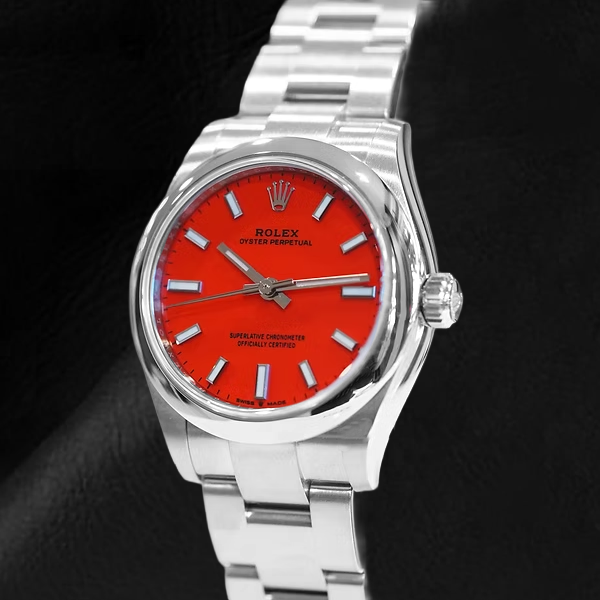 Montre en acier à cadran lumineux rouge corail Rolex huître Perpétuelle