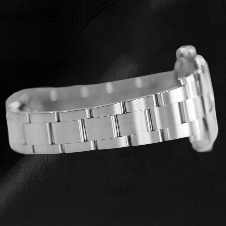 Montre en acier à cadran lumineux rouge corail Rolex huître Perpétuelle