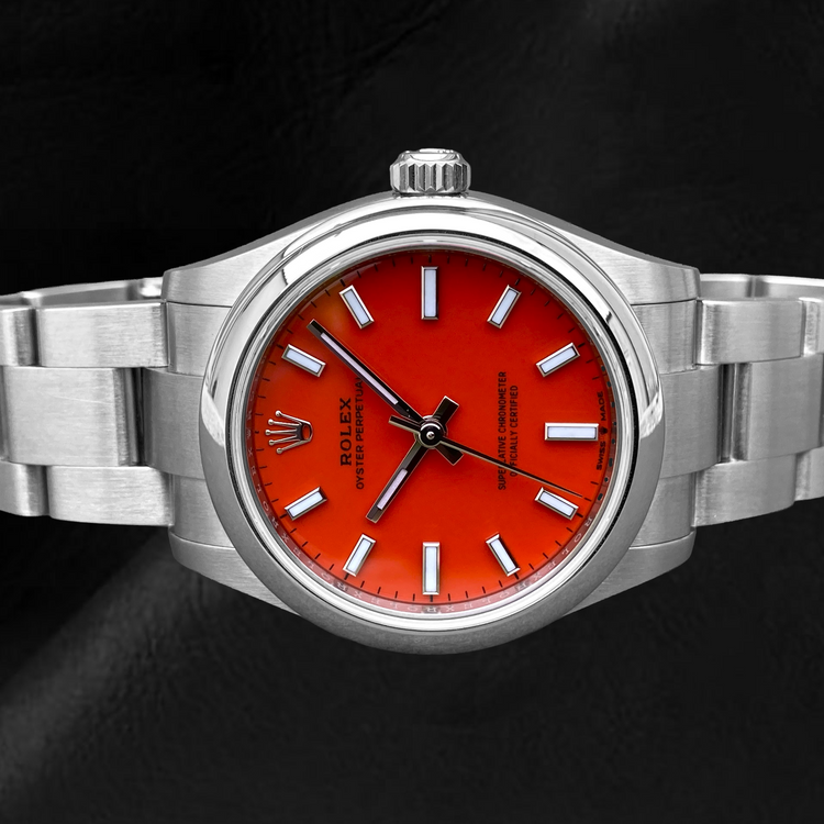 Montre en acier à cadran lumineux rouge corail Rolex huître Perpétuelle