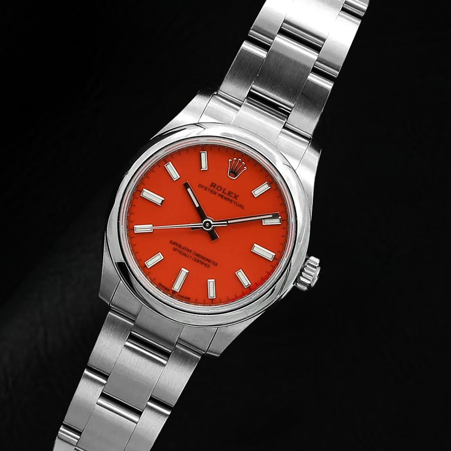Montre pour homme en acier à cadran lumineux rouge corail Rolex Oyster Perpetual 31 mm