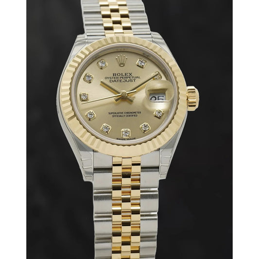 Rolex 279173 Datejust acier et lunette cannelée en or jaune 28 mm cadran diamant champagne