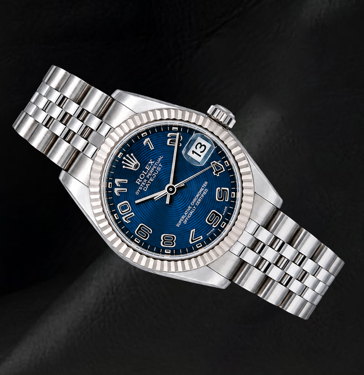 Montre Rolex Datejust 31 mm 178274 Cadran Bleu à Chiffres Arabes Lunette Cannelée en Or Blanc