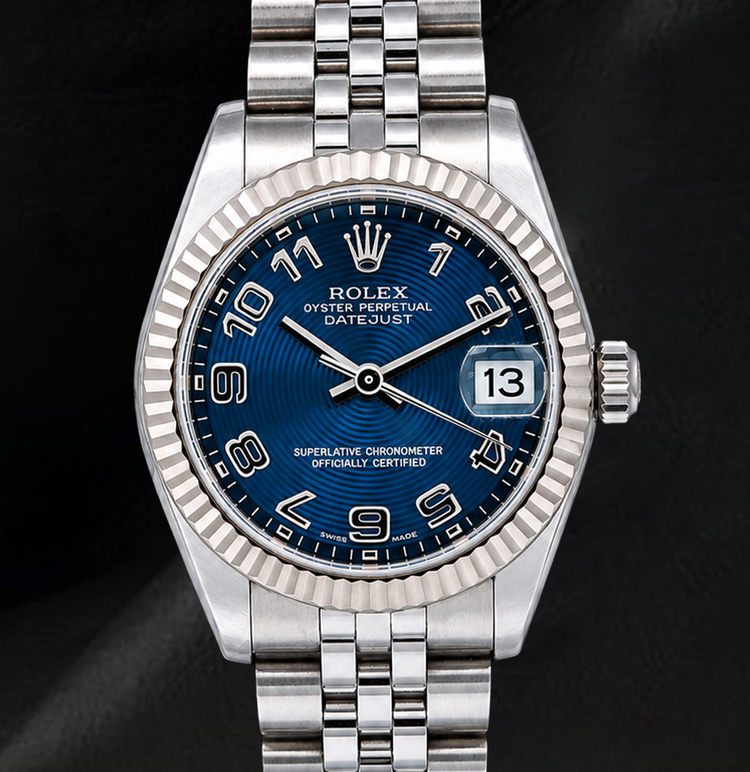 Montre Rolex Datejust 31 mm 178274 Cadran Bleu à Chiffres Arabes Lunette Cannelée en Or Blanc