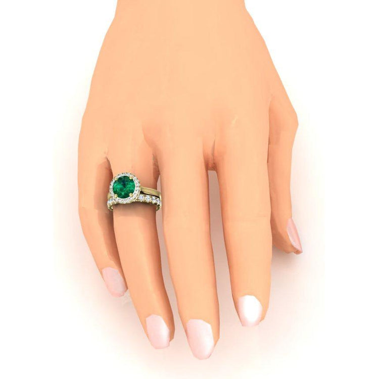 Runder Ring aus Gelbgold und grünem Smaragd