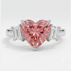Bague trois pierres en platine avec saphir padparadscha naturel taille cœur de 3,6 carats et baguettes blanches