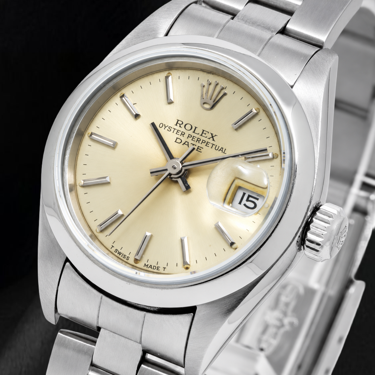 Montre Rolex Date 79160 26 mm Cadran Champagne à Index Bâtons Lunette Lisse Acier Inoxydable