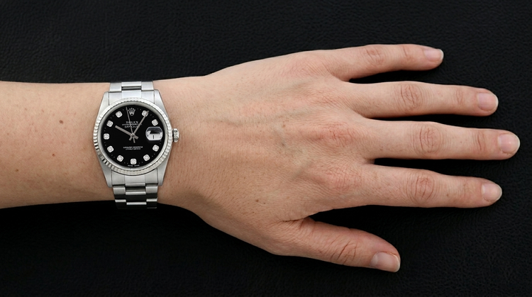 Montre Rolex Datejust, cadran noir serti de diamants, bracelet Oyster en acier inoxydable