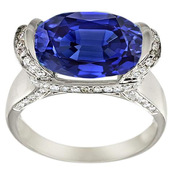 Bague diamant rond et saphir bleu taille ovale sertissage 4.50 carats - HarryChadEnt.FR