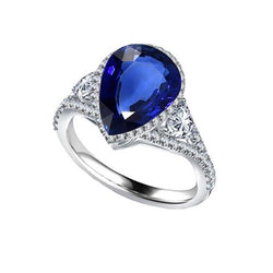 Bague Halo sertie lunette saphir bleu poire & accents de diamants 4 carats