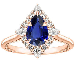 Bague de fiançailles Halo taille poire Saphir bleu et diamants 4 carats