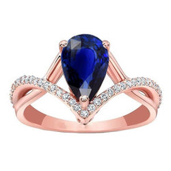Bague de fiançailles diamant rond et saphir bleu ovale en or 4.50 carats
