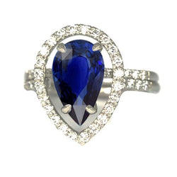 Bague de mariage Halo en or et diamants sertie au centre de saphir bleu poire 4 carats
