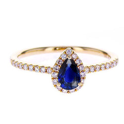Bague en or rose avec halo de diamants et saphir de Ceylan bleu profond 2.50 carats