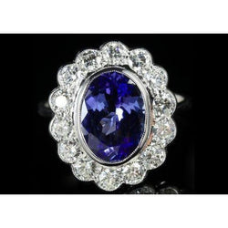 Bague en tanzanite ovale sertie de lunette de 5.15 ct avec diamants en or blanc 14 carats