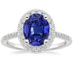 Bague saphir bleu halo taille ovale et serti de diamants 3.75 carats