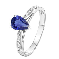 Bague solitaire avec saphir bleu et serti pavé. accents de diamants 2.50 carats